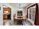 Dining room with wood table and chairs, kitchen view at 144 Bobs Sw Dr, Mableton, GA 30126