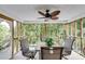 Relaxing screened porch with seating area and wooded views at 144 Bobs Sw Dr, Mableton, GA 30126