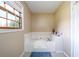 Clean bathroom with a large corner tub at 3241 Briscoe Rd, Loganville, GA 30052