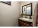 Small bathroom with granite vanity and updated fixtures at 3241 Briscoe Rd, Loganville, GA 30052