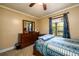 Bright bedroom with double bed, dresser, and window at 3241 Briscoe Rd, Loganville, GA 30052