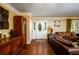 Bright entryway with hardwood floors, leading to the living room at 3241 Briscoe Rd, Loganville, GA 30052