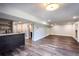 Finished basement with wet bar, large rec area, and hardwood floors at 7715 Ryefield Dr, Sandy Springs, GA 30350