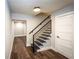 Modern staircase leading down to finished basement at 7715 Ryefield Dr, Sandy Springs, GA 30350