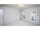 Bright and airy bedroom with two windows and neutral walls at 7715 Ryefield Dr, Sandy Springs, GA 30350