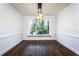 Bright dining room with hardwood floors and large window at 7715 Ryefield Dr, Sandy Springs, GA 30350