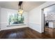 Dining room with hardwood floors, built-in window seat and kitchen view at 7715 Ryefield Dr, Sandy Springs, GA 30350