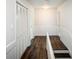 Hallway with hardwood floors and built-in storage at 7715 Ryefield Dr, Sandy Springs, GA 30350