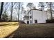 Back of house showing a large backyard and patio at 7715 Ryefield Dr, Sandy Springs, GA 30350