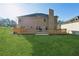 Two story house with large deck and grassy backyard at 3736 Busker Mill Ln, Ellenwood, GA 30294