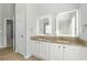 Elegant bathroom with double vanity, granite countertop and large mirrors at 3736 Busker Mill Ln, Ellenwood, GA 30294