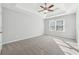 Bright bedroom with carpeted floor and ceiling fan at 3736 Busker Mill Ln, Ellenwood, GA 30294