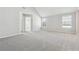 Bedroom with vaulted ceiling, carpet and two windows at 3736 Busker Mill Ln, Ellenwood, GA 30294