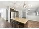 Eat in kitchen with granite island and stainless steel appliances at 3736 Busker Mill Ln, Ellenwood, GA 30294