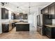 Modern kitchen with granite countertops and dark cabinetry at 3736 Busker Mill Ln, Ellenwood, GA 30294