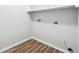 Laundry room with built-in shelving and vinyl flooring at 3736 Busker Mill Ln, Ellenwood, GA 30294