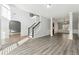 Two story foyer with hardwood floors and neutral colors at 3736 Busker Mill Ln, Ellenwood, GA 30294