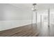 Spacious living area with hardwood floors and wainscoting at 3736 Busker Mill Ln, Ellenwood, GA 30294
