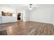 Spacious living room with hardwood floors and kitchen view at 3736 Busker Mill Ln, Ellenwood, GA 30294