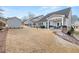 Large backyard with grassy area and sloped terrain at 91 Harris St, Buford, GA 30518