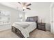 Bedroom with gray platform bed and ceiling fan at 91 Harris St, Buford, GA 30518