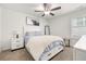 Bedroom with white bed frame and ceiling fan at 91 N. Harris St, Buford, GA 30518