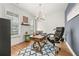 Home office with wood desk, chair, and wood-look floors at 91 Harris St, Buford, GA 30518