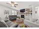 Spacious living room featuring fireplace and built-in shelving at 91 Harris St, Buford, GA 30518