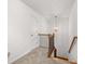 Upstairs hallway with carpet, railing, and light fixture at 91 N. Harris St, Buford, GA 30518