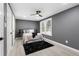 Spacious bedroom with grey walls, hardwood floors and ceiling fan at 2007 North Nw Ave, Atlanta, GA 30318