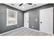 Simple bedroom with grey walls, hardwood floors and window at 2007 North Nw Ave, Atlanta, GA 30318