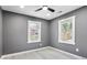 Bright bedroom with gray walls, two windows, and ceiling fan at 2007 North Nw Ave, Atlanta, GA 30318