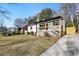 Charming house with a newly renovated exterior, landscaped lawn, and a spacious driveway at 2007 North Nw Ave, Atlanta, GA 30318