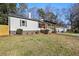 Recently updated home with a white exterior, gray accents and a well-manicured lawn at 2007 North Nw Ave, Atlanta, GA 30318