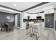 Modern kitchen with white cabinets, stainless steel appliances and an island with seating at 2007 North Nw Ave, Atlanta, GA 30318