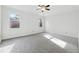 Spacious bedroom with grey carpet and ceiling fan at 3182 Henderson Walk, Atlanta, GA 30340