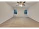 Spacious bedroom with neutral carpeting and ceiling fan at 129 Baywood Xing, Hiram, GA 30141