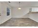 Bright dining room features wood-look floors and a modern light fixture at 129 Baywood Xing, Hiram, GA 30141