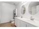 Double vanity bathroom with oval mirrors and tiled floor at 45 Kendall Ln, Covington, GA 30014