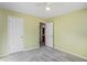 Bedroom with carpet, ceiling fan, and access to bathroom at 45 Kendall Ln, Covington, GA 30014