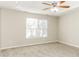 Well-lit bedroom with neutral walls and plush carpeting at 4905 Bridle Point Pkwy, Snellville, GA 30039