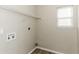 Bright laundry room with shelving and window at 4905 Bridle Point Pkwy, Snellville, GA 30039