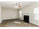 Spacious living room featuring a fireplace and wood-look tile floors at 4905 Bridle Point Pkwy, Snellville, GA 30039