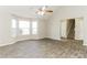 Open living room with tile floors and access to staircase at 4905 Bridle Point Pkwy, Snellville, GA 30039