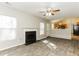 Open living room with tile floors, fireplace, and kitchen views at 4905 Bridle Point Pkwy, Snellville, GA 30039