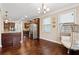 Dining area with hardwood floors and view of kitchen at 4705 Sanderling St, Cumming, GA 30041