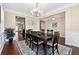 Formal dining room with hardwood floors and chandelier at 4705 Sanderling St, Cumming, GA 30041