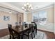 Bright dining room with hardwood floors and chandelier at 4705 Sanderling St, Cumming, GA 30041