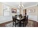 Formal dining room with hardwood floors and chandelier at 4705 Sanderling St, Cumming, GA 30041