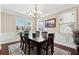 Spacious dining room with hardwood floors and chandelier at 4705 Sanderling St, Cumming, GA 30041